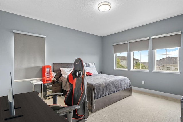 carpeted bedroom with a textured ceiling