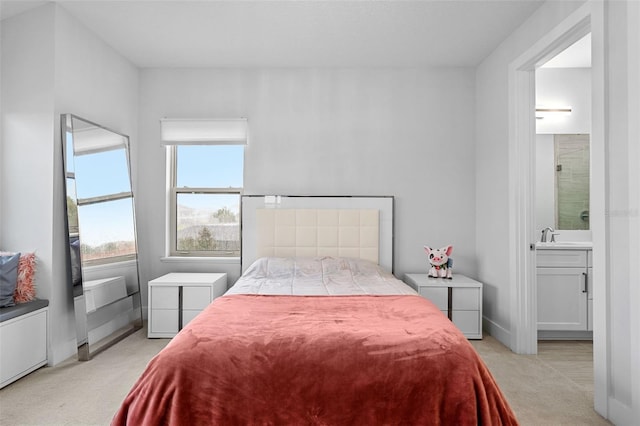 carpeted bedroom with ensuite bathroom