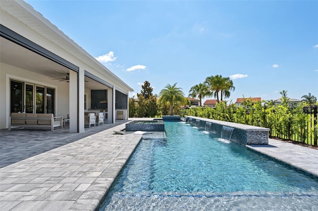 view of swimming pool featuring a patio, ceiling fan, and an in ground hot tub