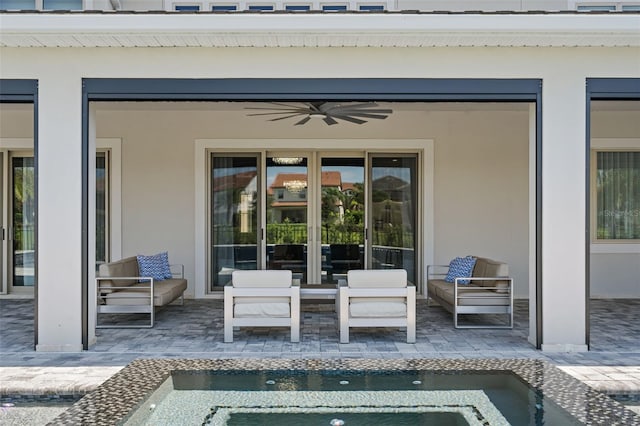 view of patio with an outdoor living space and ceiling fan