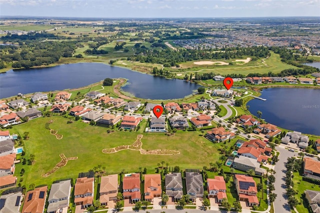 birds eye view of property featuring a water view