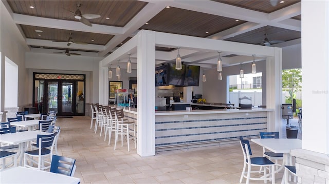 kitchen with ceiling fan, french doors, hanging light fixtures, and wood ceiling