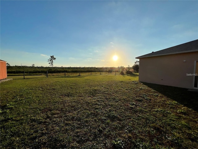 view of yard with a rural view