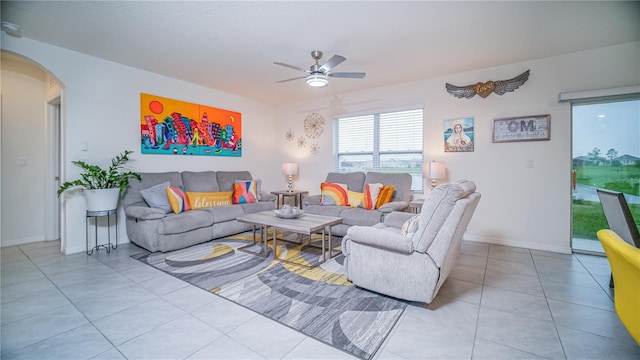 tiled living room with ceiling fan