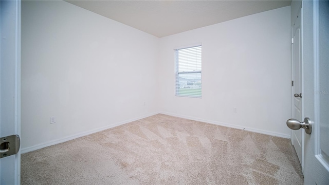 empty room featuring light carpet