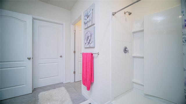 full bath with tile patterned flooring and walk in shower