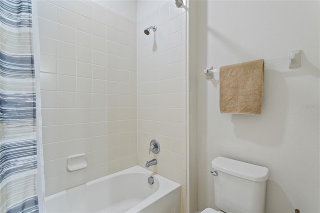 full bathroom featuring shower / tub combo and toilet