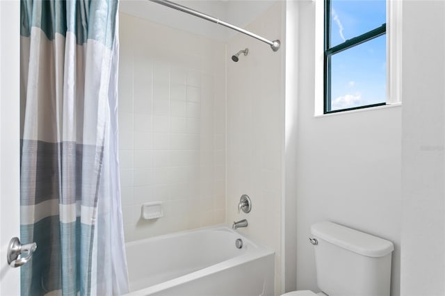 bathroom with toilet and shower / tub combo with curtain