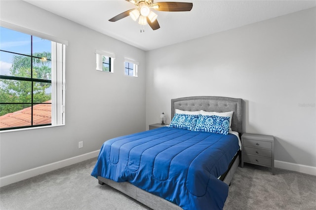 bedroom featuring carpet floors, a ceiling fan, and baseboards