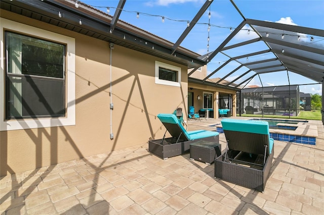 view of patio / terrace featuring a lanai, an outdoor pool, and an in ground hot tub