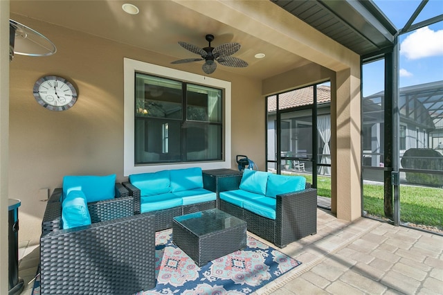 view of patio / terrace with ceiling fan, glass enclosure, and outdoor lounge area