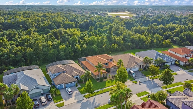 aerial view featuring a residential view and a view of trees