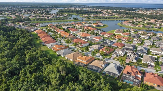 birds eye view of property featuring a residential view and a water view