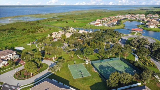 drone / aerial view featuring a water view and a residential view