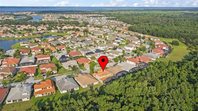 drone / aerial view with a residential view and a water view