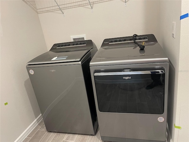 laundry area with independent washer and dryer