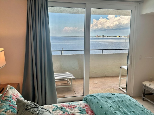 bedroom featuring a water view