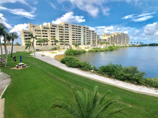 exterior space with a water view and a yard