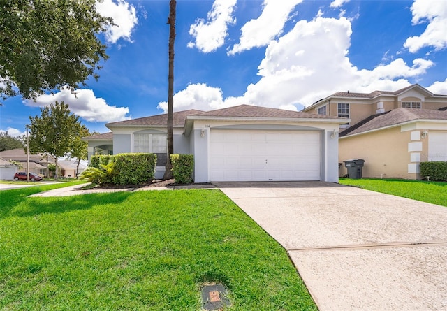 view of front of house featuring a garage and a front lawn