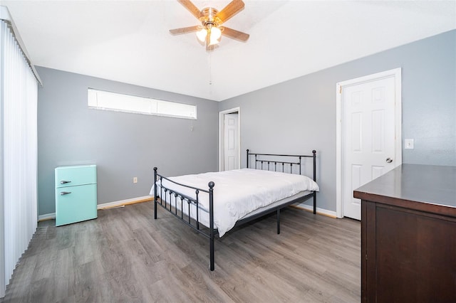 bedroom featuring ceiling fan and light wood-type flooring