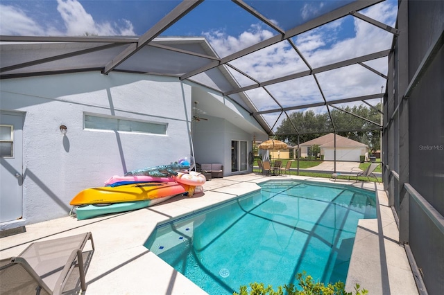 view of swimming pool with a patio and a lanai