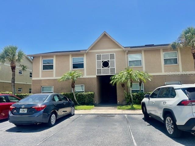 multi unit property with uncovered parking and stucco siding