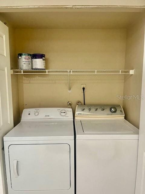 washroom with separate washer and dryer