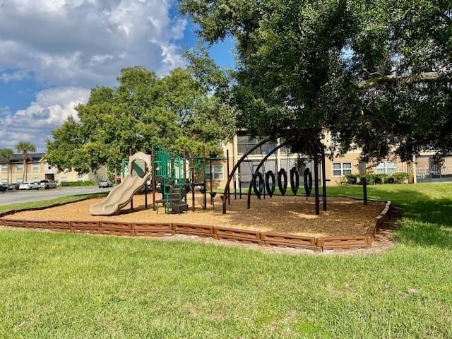 community play area featuring a lawn