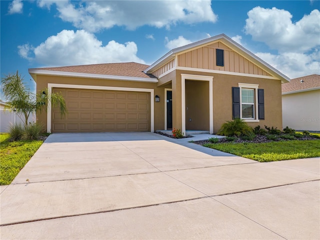 view of front facade with a front lawn and a garage