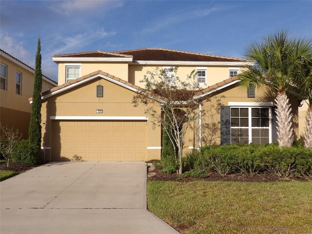 5265 Oakbourne Ave, Davenport, FL 33837 - view of front of home featuring concrete driveway and stucco siding