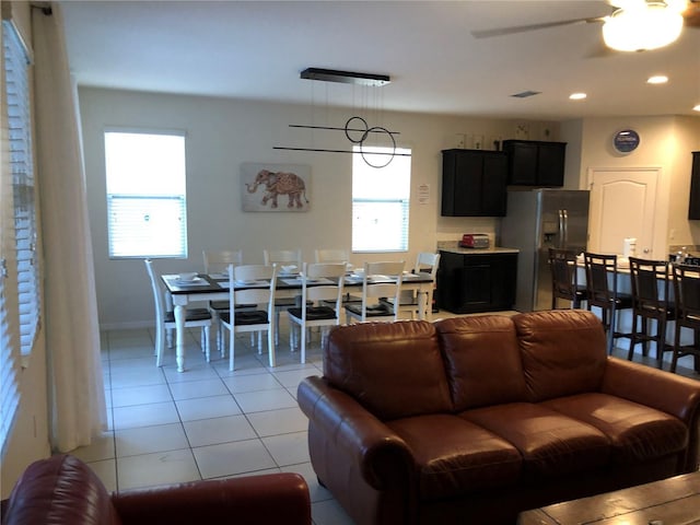 5265 Oakbourne Ave, Davenport, FL 33837 - living room with light tile patterned flooring, a ceiling fan, recessed lighting, and baseboards