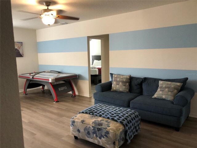 game room featuring ceiling fan and hardwood / wood-style flooring