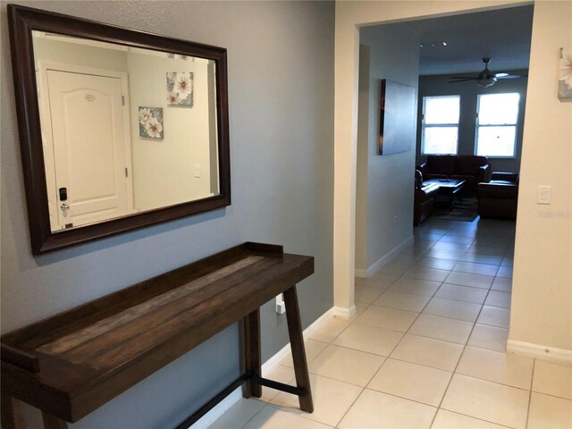 5265 Oakbourne Ave, Davenport, FL 33837 - corridor with light tile patterned floors and baseboards