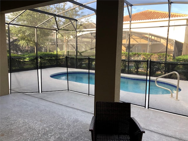 view of pool with a lanai and a patio