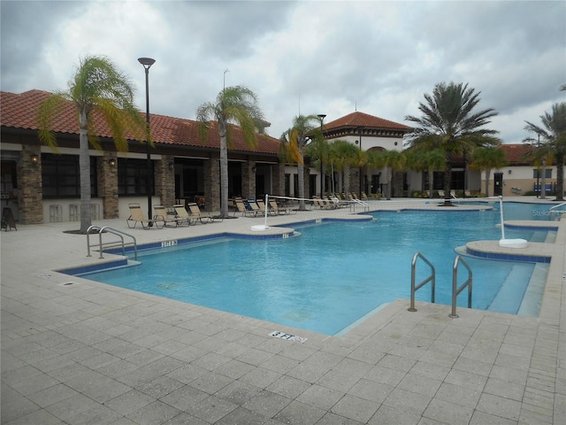 view of swimming pool with a patio