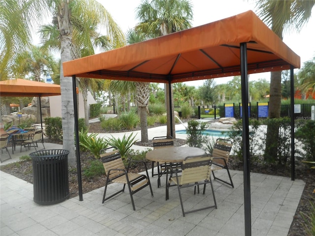 view of patio with a gazebo and a community pool