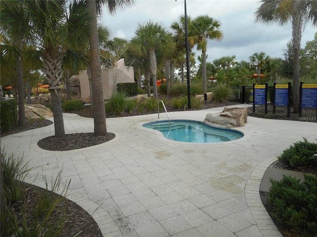 view of swimming pool featuring a patio