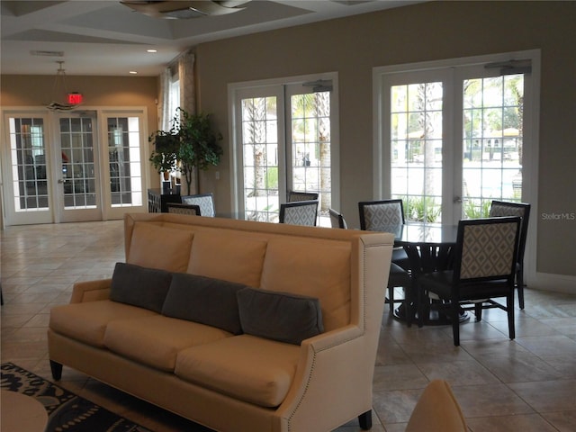 living room with light tile patterned flooring and french doors