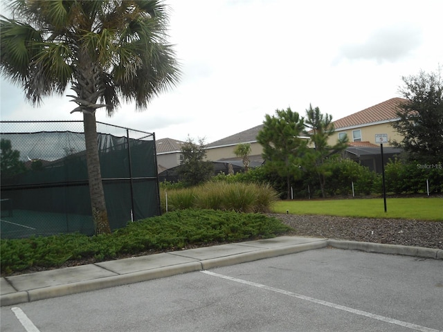 5265 Oakbourne Ave, Davenport, FL 33837 - uncovered parking lot featuring fence