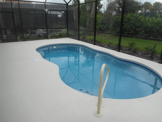 view of pool featuring a patio and a lanai