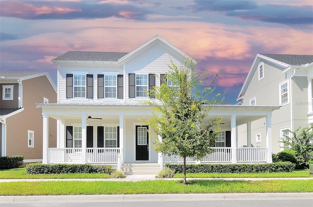 view of front of property featuring ceiling fan and covered porch