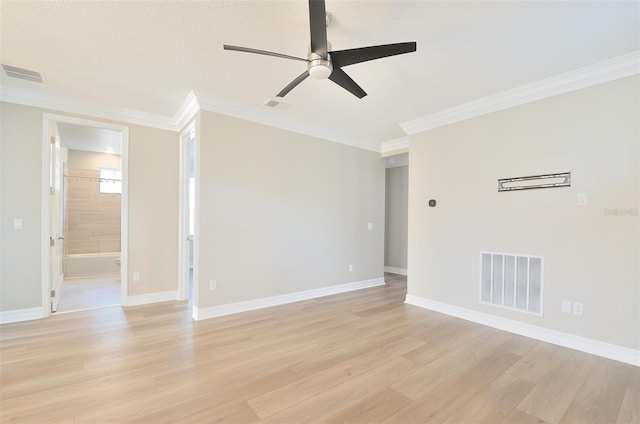 empty room with ceiling fan, light hardwood / wood-style flooring, and ornamental molding