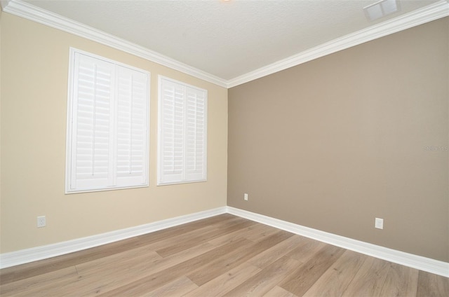 unfurnished room featuring light hardwood / wood-style floors, crown molding, and a textured ceiling