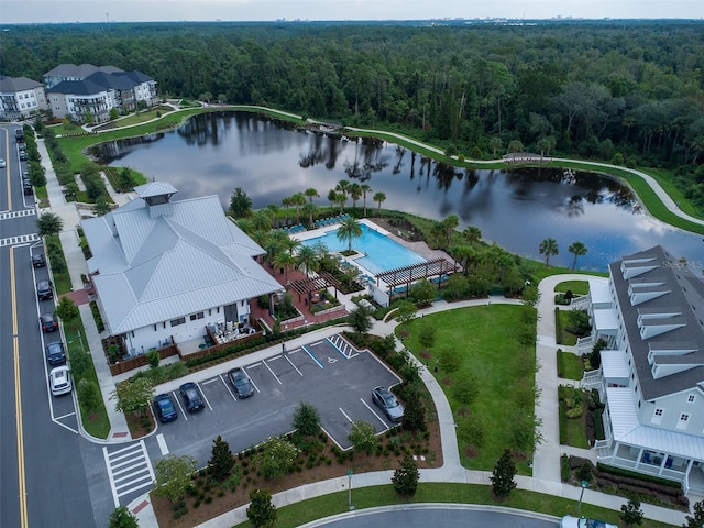 birds eye view of property with a water view