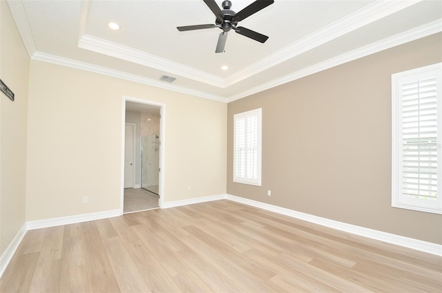 1862 Beach Ridge Rd, Celebration, FL 34747 - spare room with light wood finished floors, a ceiling fan, crown molding, baseboards, and a raised ceiling