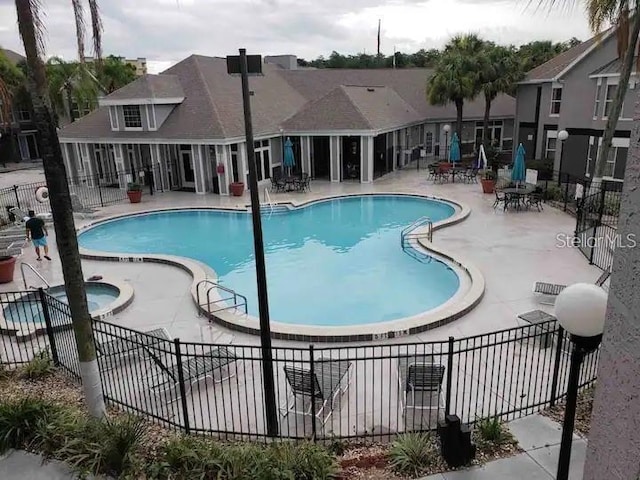 view of swimming pool with a patio area