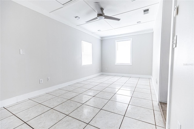 empty room with light tile patterned floors and ceiling fan