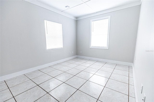 unfurnished room with light tile patterned floors