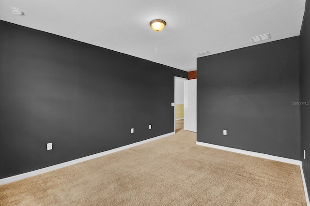 empty room with light colored carpet