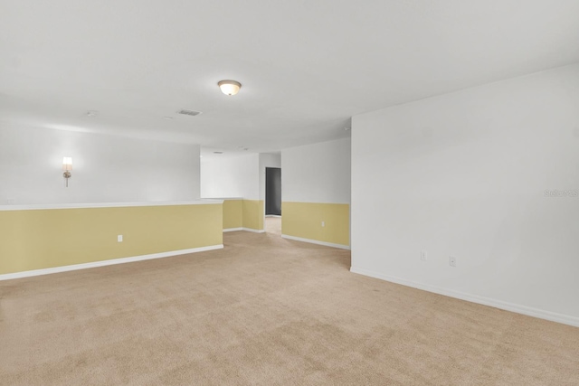 empty room featuring light colored carpet